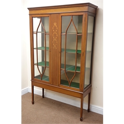  Edwardian inlaid mahogany display cabinet, projecting cornice, two astragal glazed doors enclosing three shelves, square tapering supports on spade feet, W106cm, H172cm, D37cm  