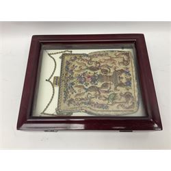 Continental petit point evening bag, with enamel and pearl details, in wooden display frame, together with a snake skin handbag and three other vintage bags