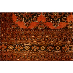  Large Persian red ground carpet, repeating border, 285cm x 364cm  