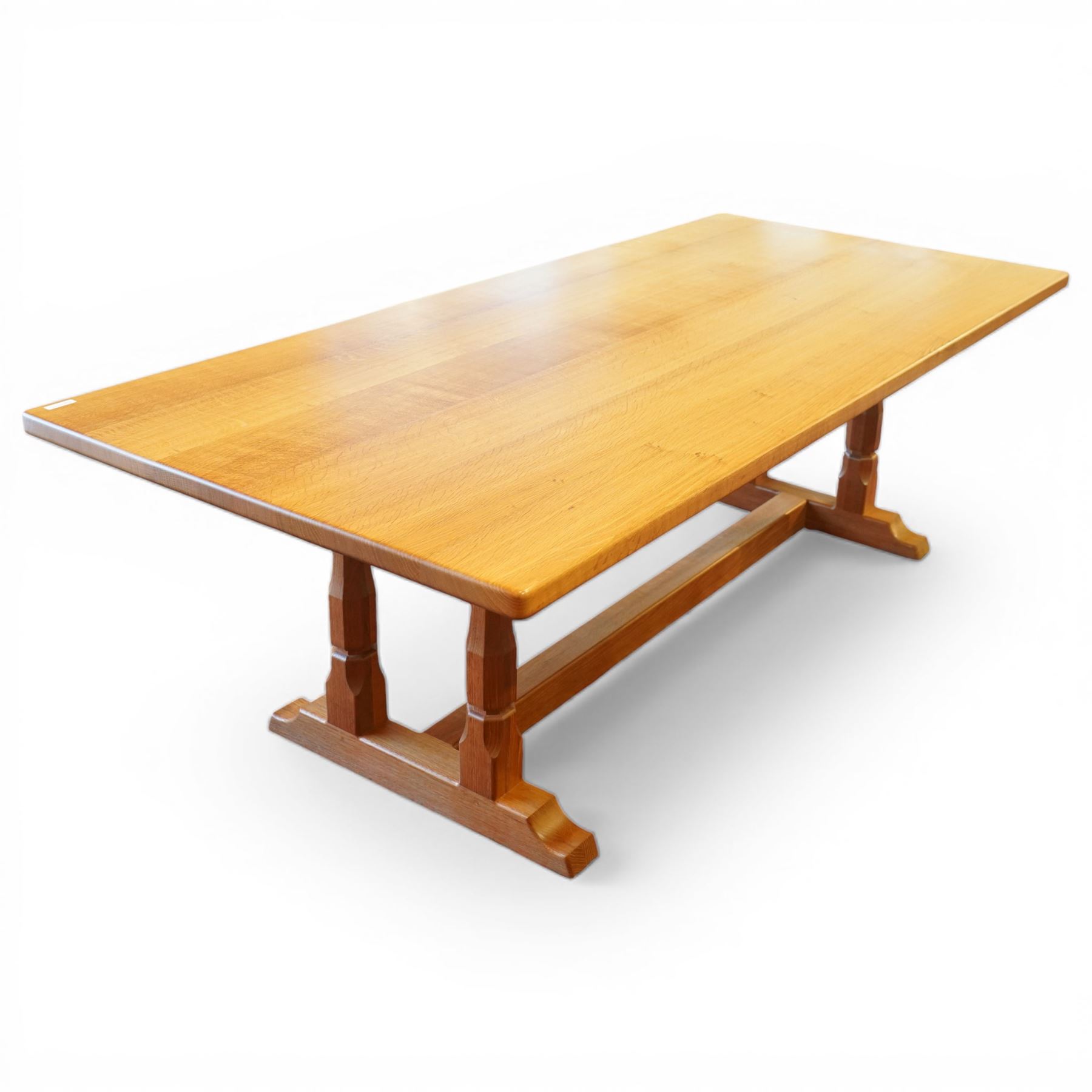 Knightman - oak rectangular refectory four pillar dining table, rectangular plank top, over twin pillar supports to both ends, united by a single stretcher with sled feet, with carved knight signature, by Horace Knight of Thirsk