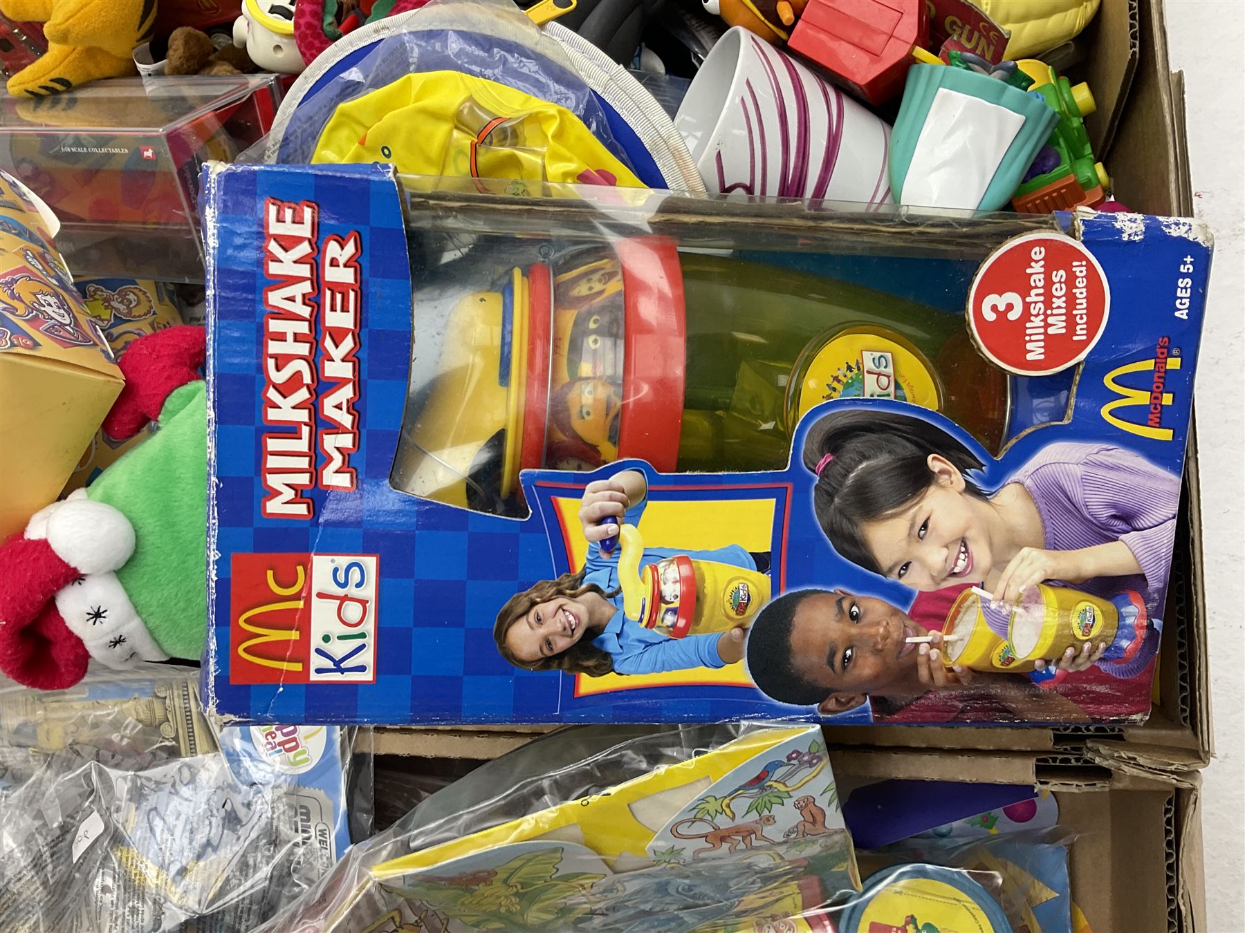 Large quantity of Mcdonalds toys to include Matchbox in four boxes