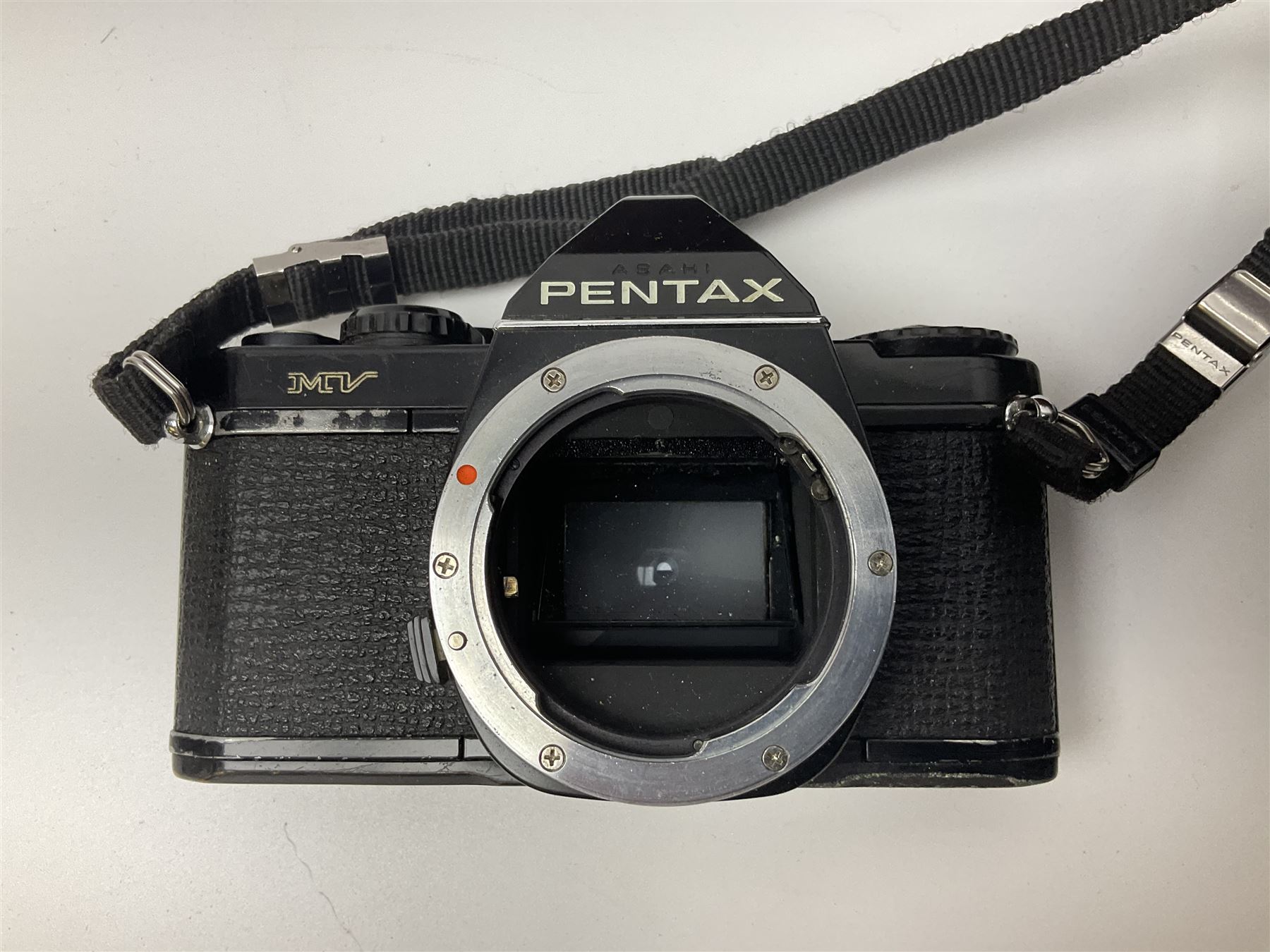 Four Minolta camera bodies, to include Dynax 500si, serial no. 94812651 with 'Signa Zoom 1;3.5-4.5 f=28-70mm' lens, Maxxum 300si, serial no. 97821665, with 'Tamron AF 80-210mm' lens and Dynax 300si, serial no 01603265'  with Minolta AF Power Zoom 35-80mm 1;4' lens, etc, together with Pantax MV1 camera bodies and other camera equipment 