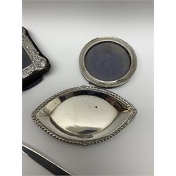 Small silver hallmarked pin tray, hallmarked for London, together with two small silver hallmarked mounted photograph frames, and mother of pearl handled knife with silver blade 