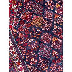 Persian Meimeh indigo ground rug, the central medallion within a field of small floral lozenge motifs, the guarded border with repeating pattern