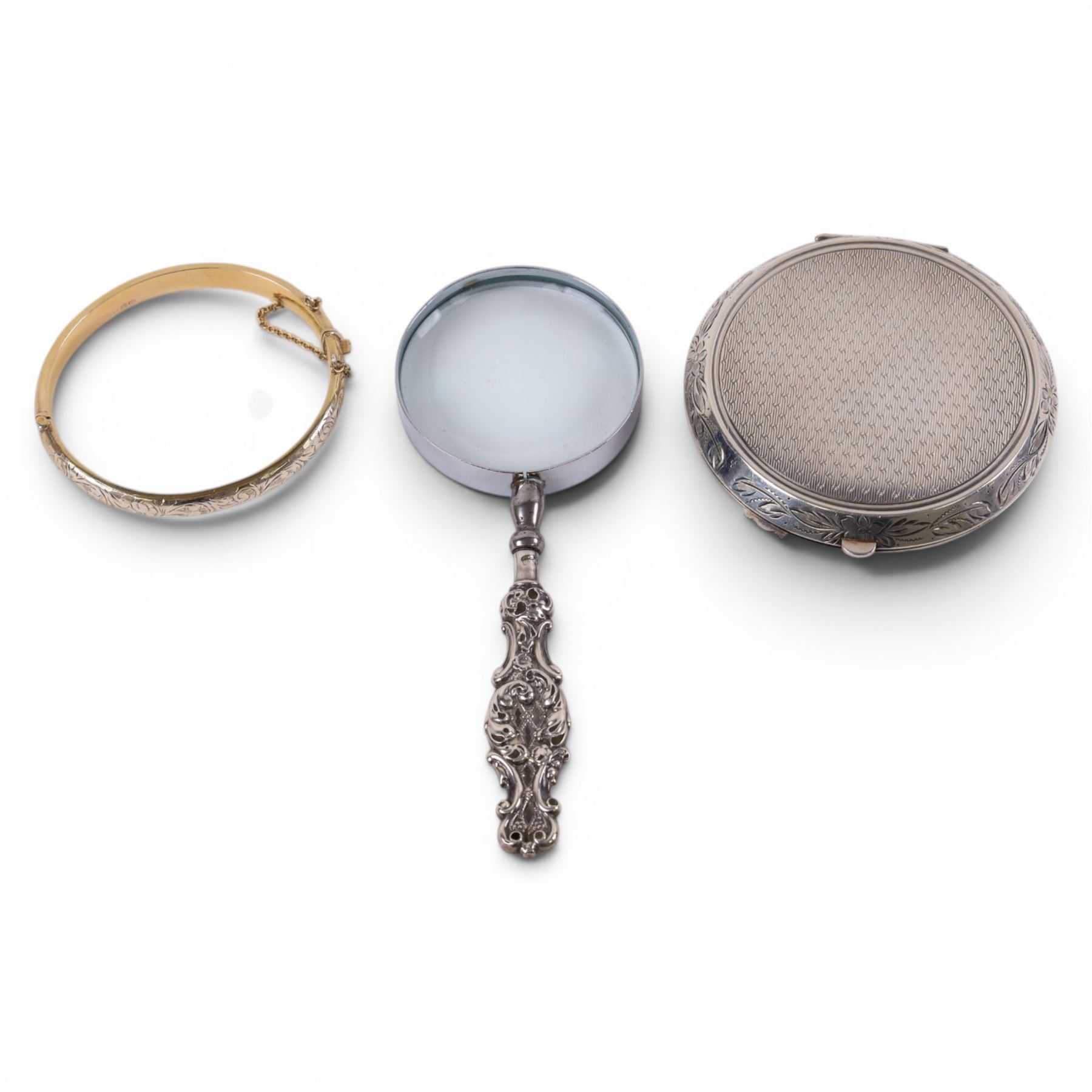 Silver compact mirror, silver handled magnifying glass and a silver-gilt bangle, all hallmarked