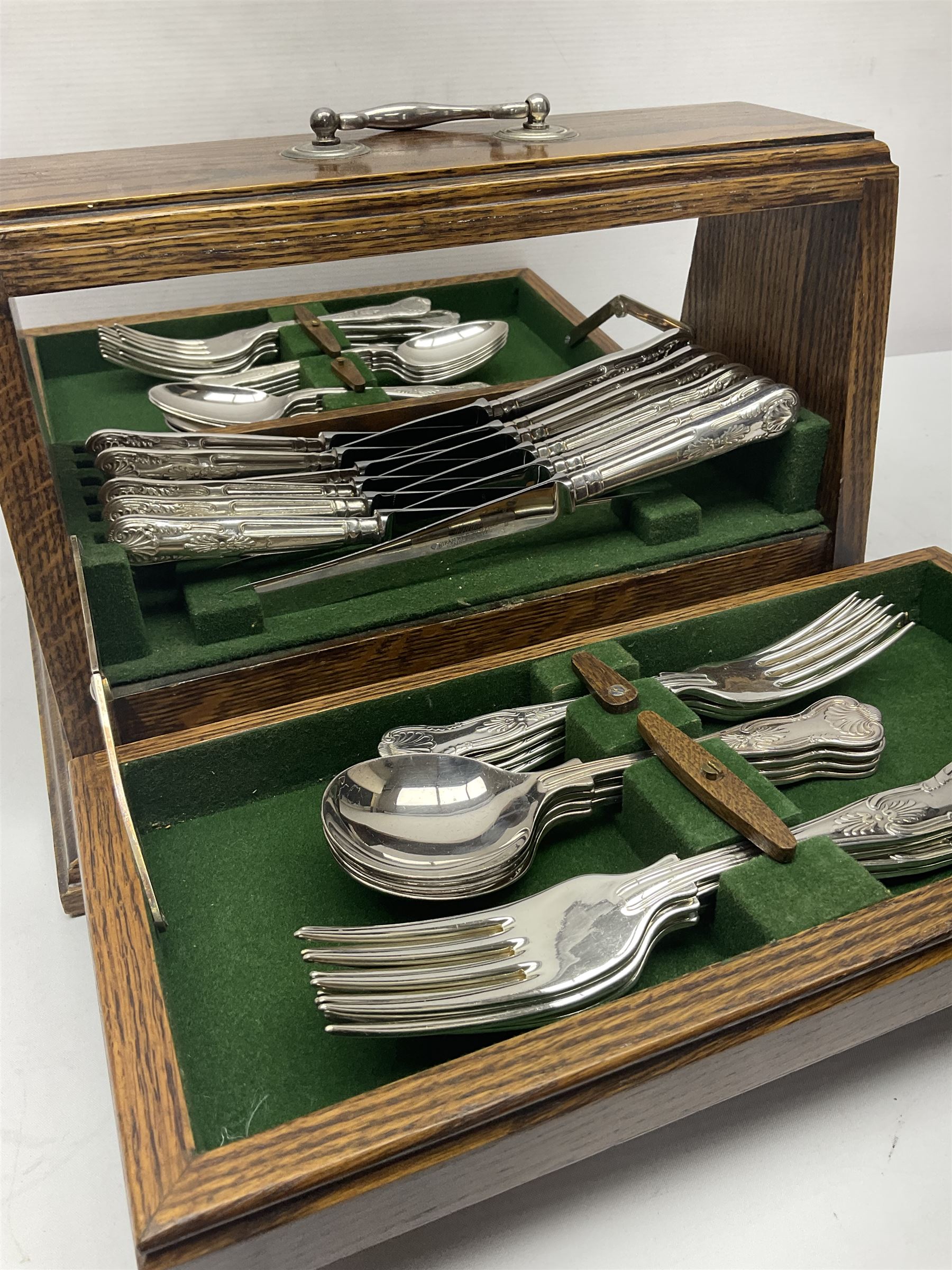 Silver plated canteen of kings pattern cutlery, house in oak canteen of trapezium form 