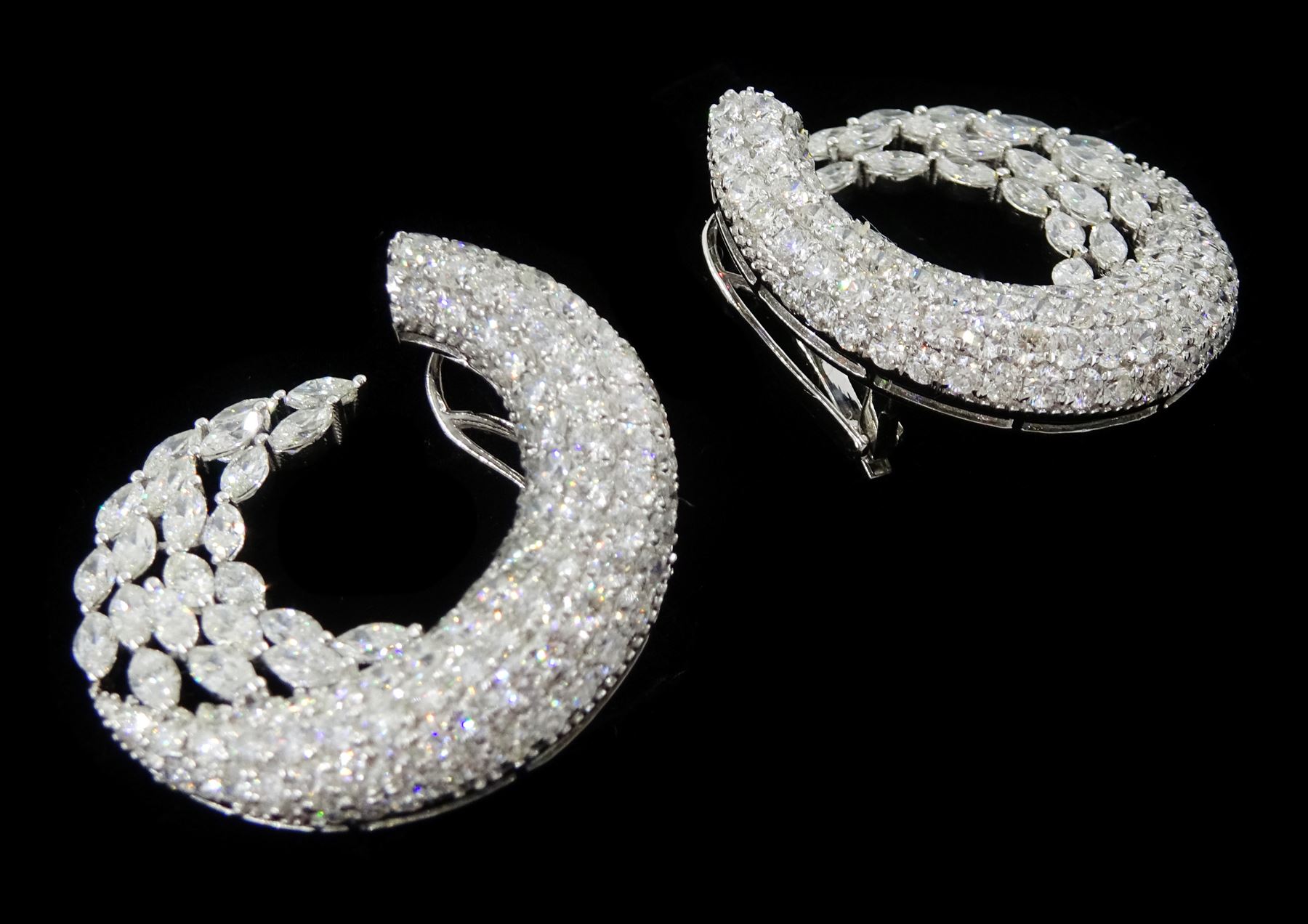 Pair of 18ct white gold marquise cut and pave set, round brilliant cut diamond crescent stud earrings, stamped, total diamond weight approx 9.30 carat