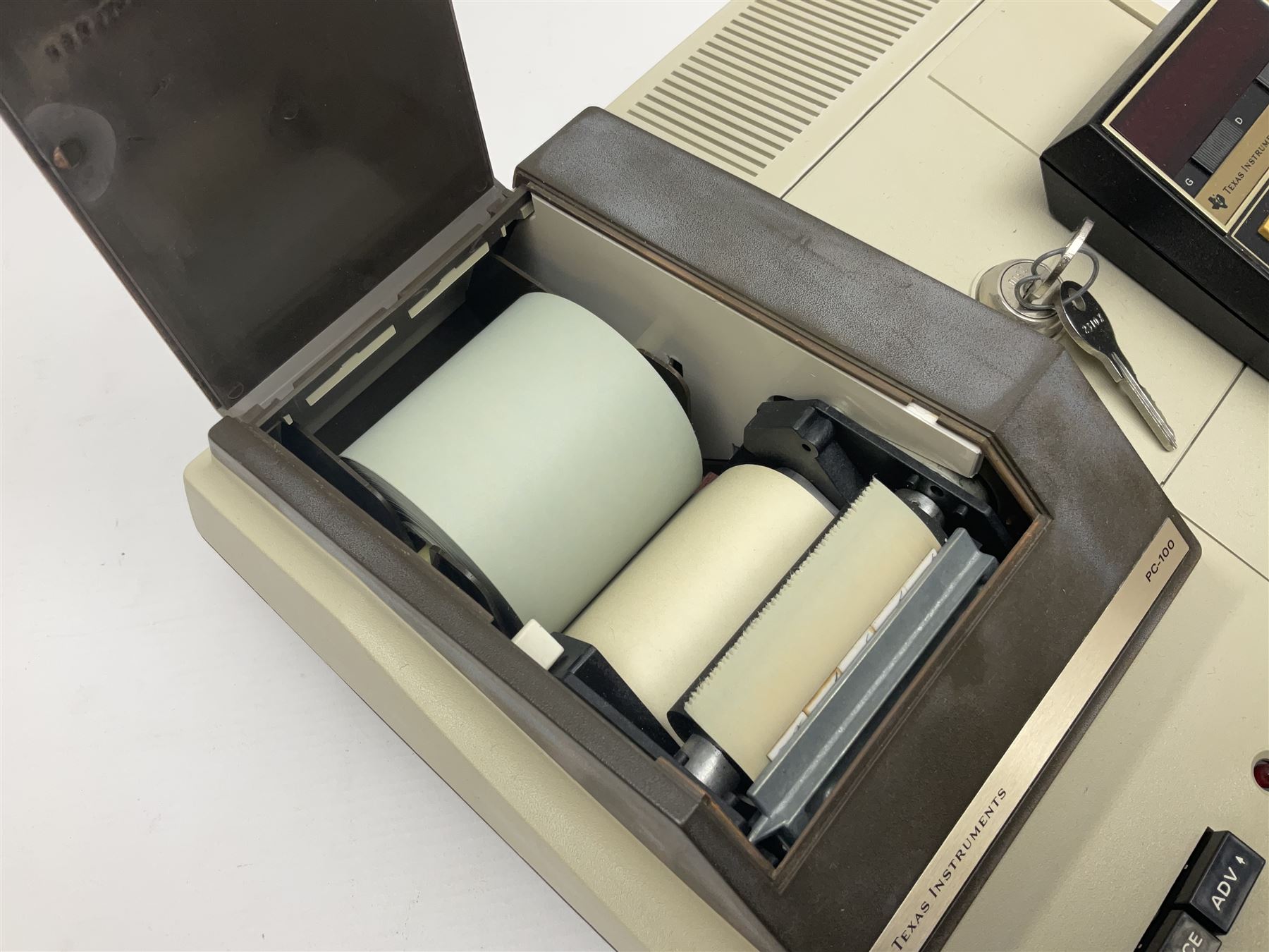 Four 1970s Sinclair electronic calculators - Cambridge in hard case with booklet; Scientific Programmable with Program Library and booklet; Scientific in hard case; and Oxford 300 in soft case with booklet; together with Texas PC-100 SR56 programmable slide-rule calculator on base station with readout, two booklets, keys and cover, serial no.9103093