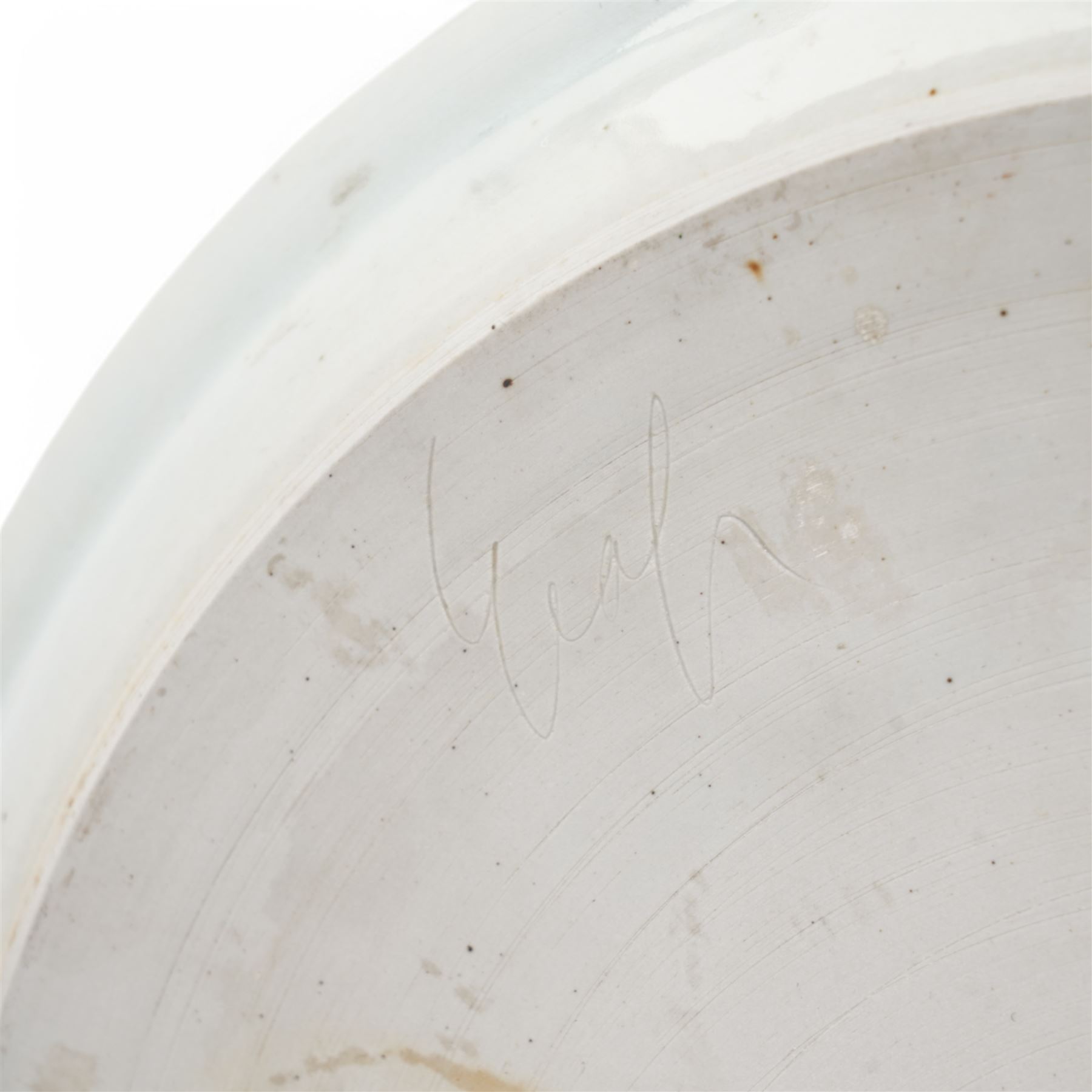 Poh Chap Yeap (Chinese/British 1927-2007); celadon glazed plate and solifleur vase, the plate decorated with a branch of cherry blossom, incised signature to bases, plate D29cm, vase H11cm (2)