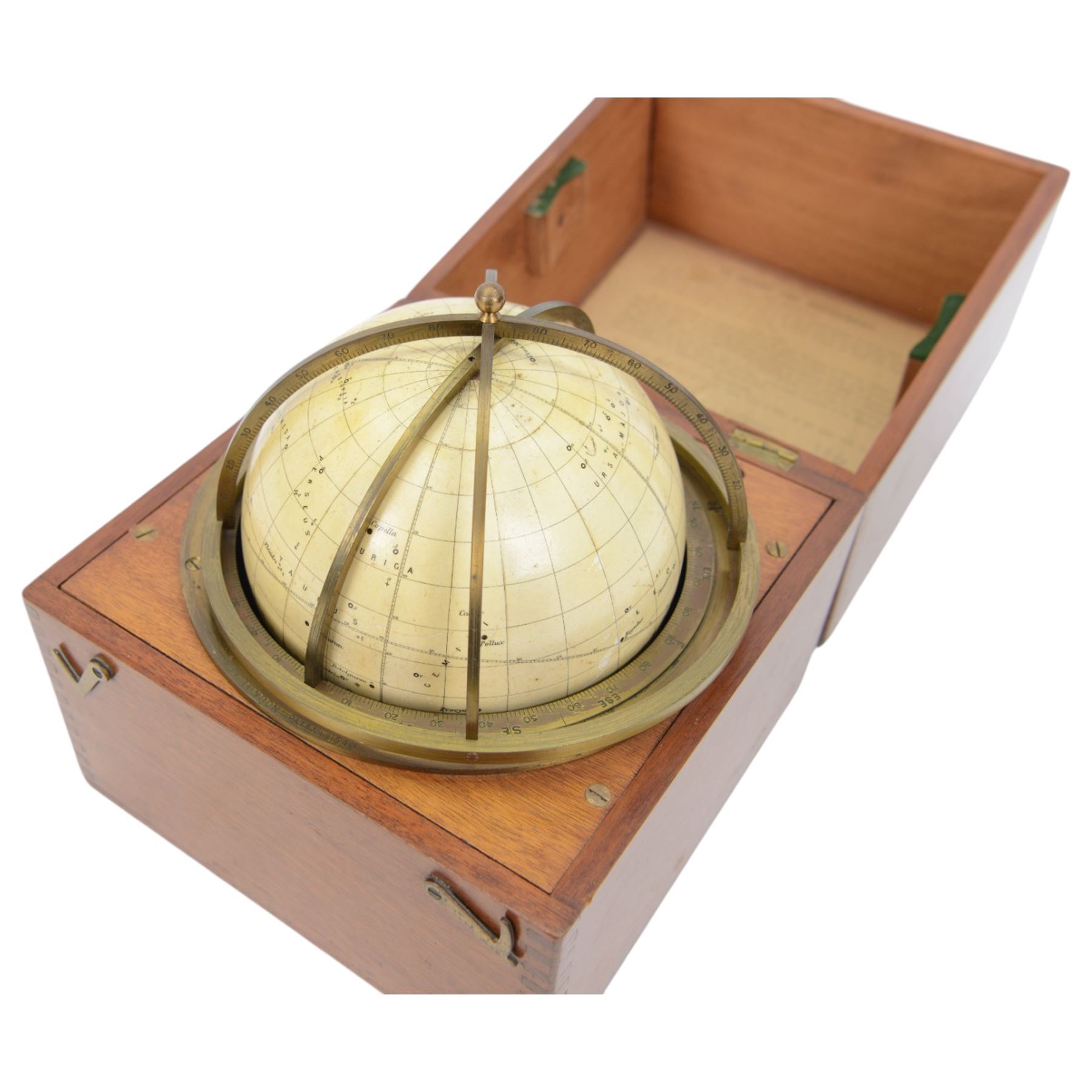 Cary Porter Ltd celestial navigational star globe patent no. 21450, the cream coloured sphere printed in black with stars and constellations, with brass meridian and horizon rings, contained within a fitted wooden box with paper instruction label to interior, globe diameter 11.5cm, box H21cm