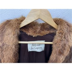 Brown mid length musquash fur coat by National Fur Company together with white rabbit cape
