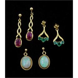 Three pairs of 9ct gold pendant stud earrings including opal, emerald and ruby