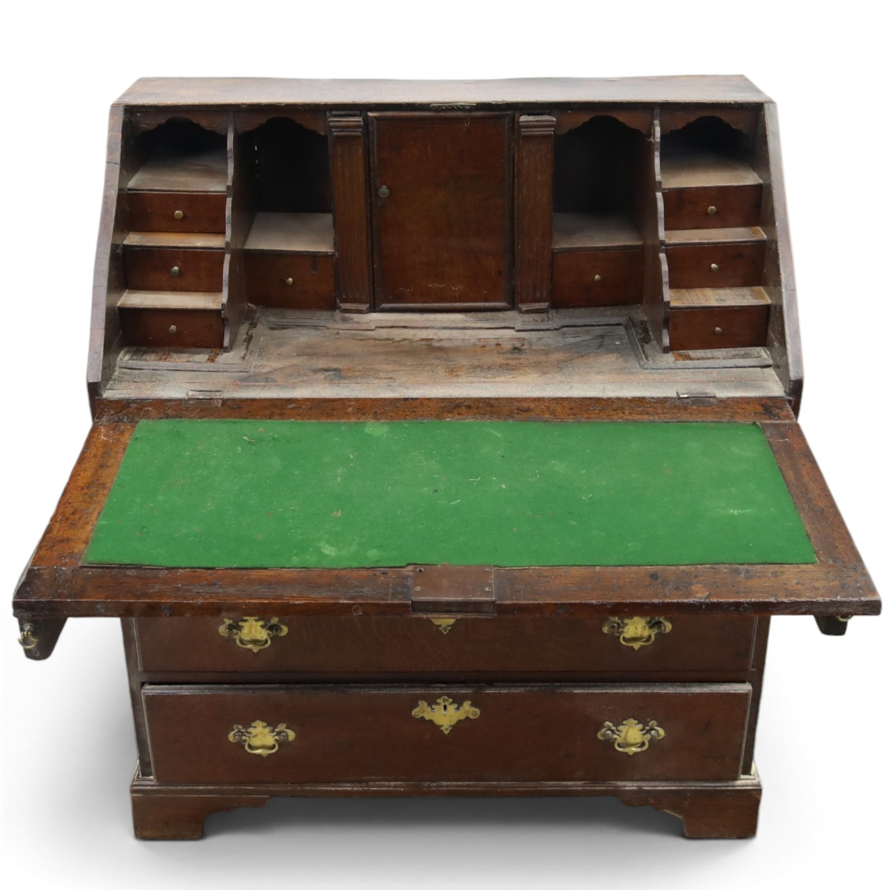 18th century inlaid oak bureau, the fall-front with central star inlay enclosing fitted interior with central cupboard flanked by fluted column correspondence drawers and pigeon holes, over two short and three long drawers, lower moulded edge on bracket feet