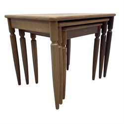 G-Plan - teak nest of three tables, rectangular top raised on turned supports