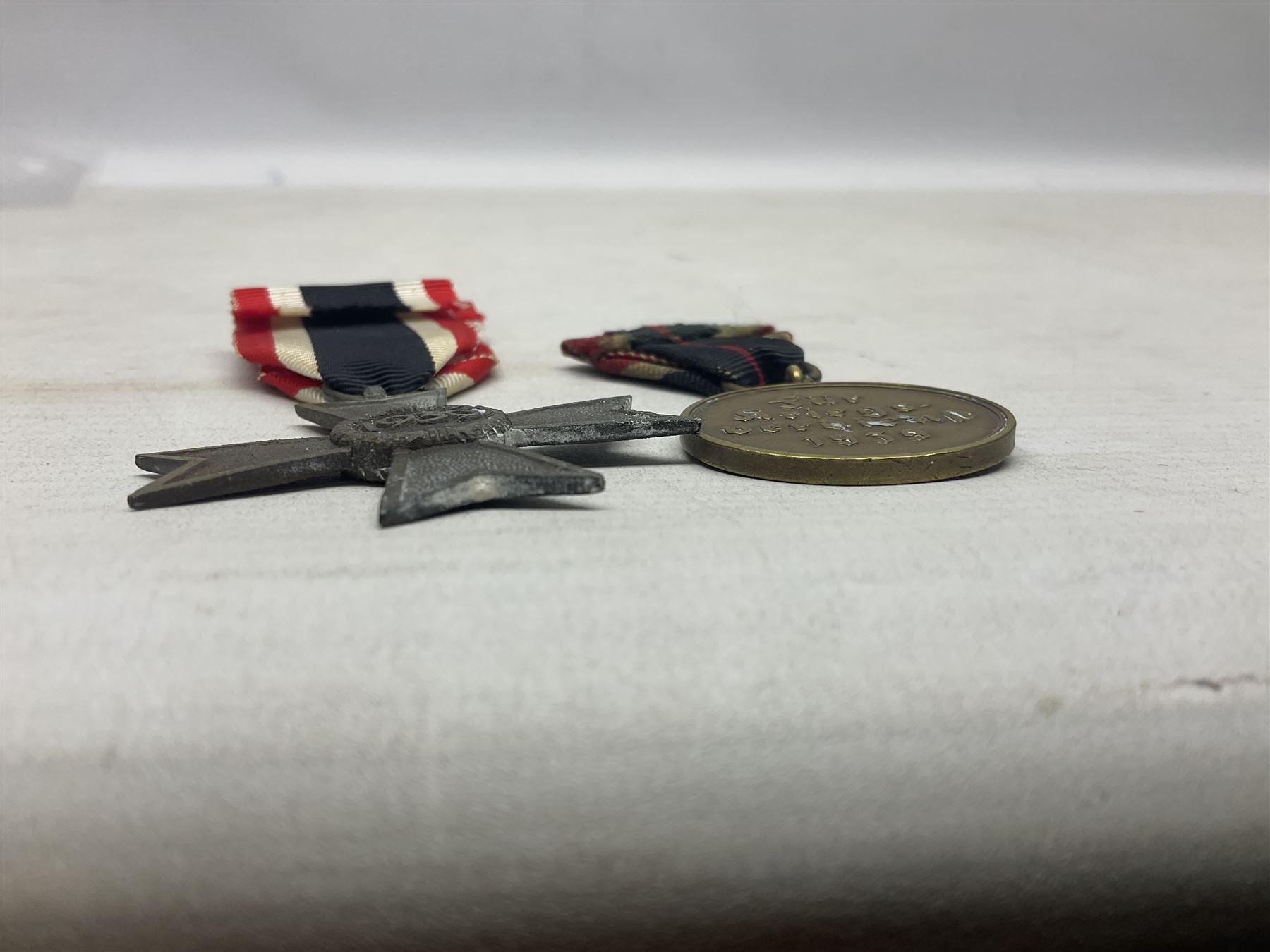 Two WW1 German medals - copy Cross of Honour with swords (combatants); Cross of Honour without swords (non-combatants); and two WW2 German medals - War Merit Medal; and War Merit Cross; all with ribbons (4)