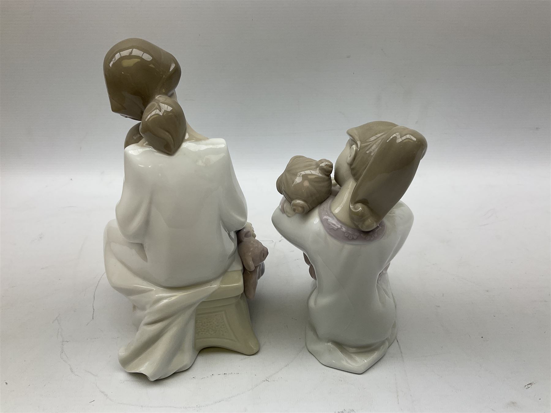 Collection of Nao figures, to include 'Moment with Mummy' no.1429, 'Stories with Grandma' no.1512, 'A Hug of Love' no.1467, together with fourteen further Nao figures and a Cascades clown figure