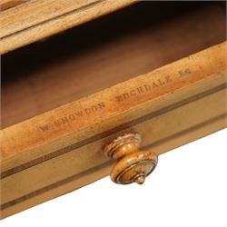 William Snowdon of Rochdale (fl.1876-1886) - Victorian sycamore chest of drawers, rectangular top with shaped gallery back above an arrangement of three short and three long drawers, each with moulded borders and turned wooden pulls, flanked by carved upright corbels, on a plinth base (99cm height including gallery)