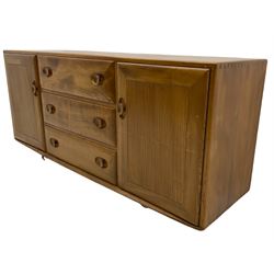 Ercol elm sideboard, three drawers and two cupboards, on castors