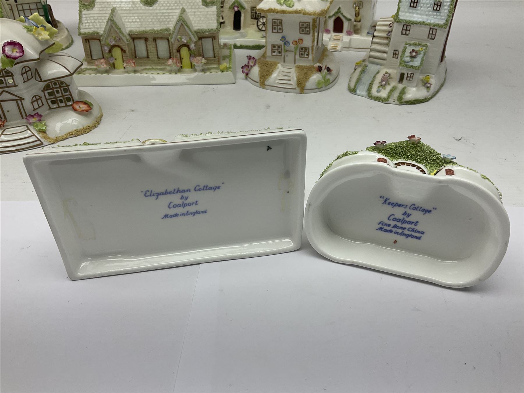 Eleven Coalport cottages, including Park Folly, The Alms House, Watermill and The Summer House, each with printed marks beneath