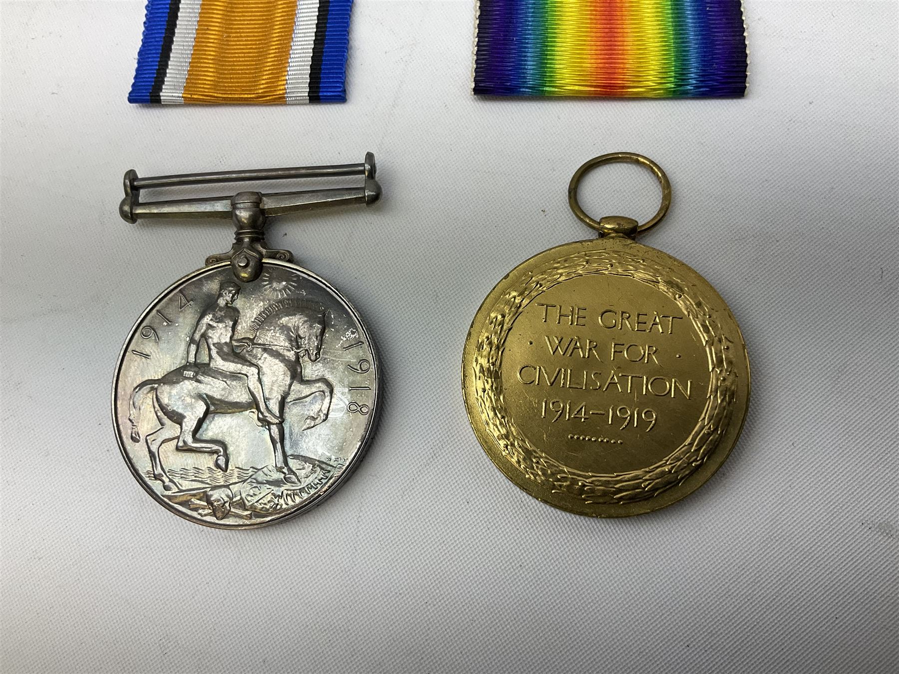 WW1 group of three medals comprising British War Medal and Victory Medal in issue box and Ceylon Volunteer Service Medal awarded to 10288 Pte. M. Smith R. Fus.; together with a later awarded WW2 Defence Medal in modern box with slip; and his QEII Imperial Service Medal in case and box with certificate dated 1959