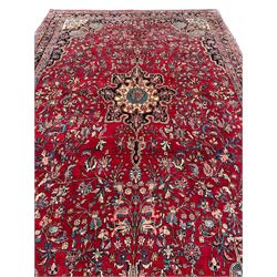 North West Persian Bidjar red ground carpet, shaped pole medallion surrounded by interlacing branches and stylised flower heads, five band border with repeating floral design