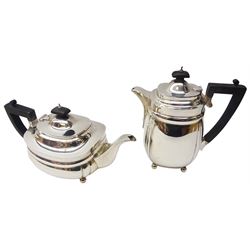1930's silver four piece tea service, comprising teapot, hot water pot, twin handled open sucrier, and milk jug, each of oval form upon four ball feet, the teapot and hot water pot with ebonised handle and finial, hallmarked Z Barraclough & Sons, London 1930, 1931, teapot H15cm hot water pot H21.5cm, approximate total gross weight 67.36 ozt (2095.3 grams)
