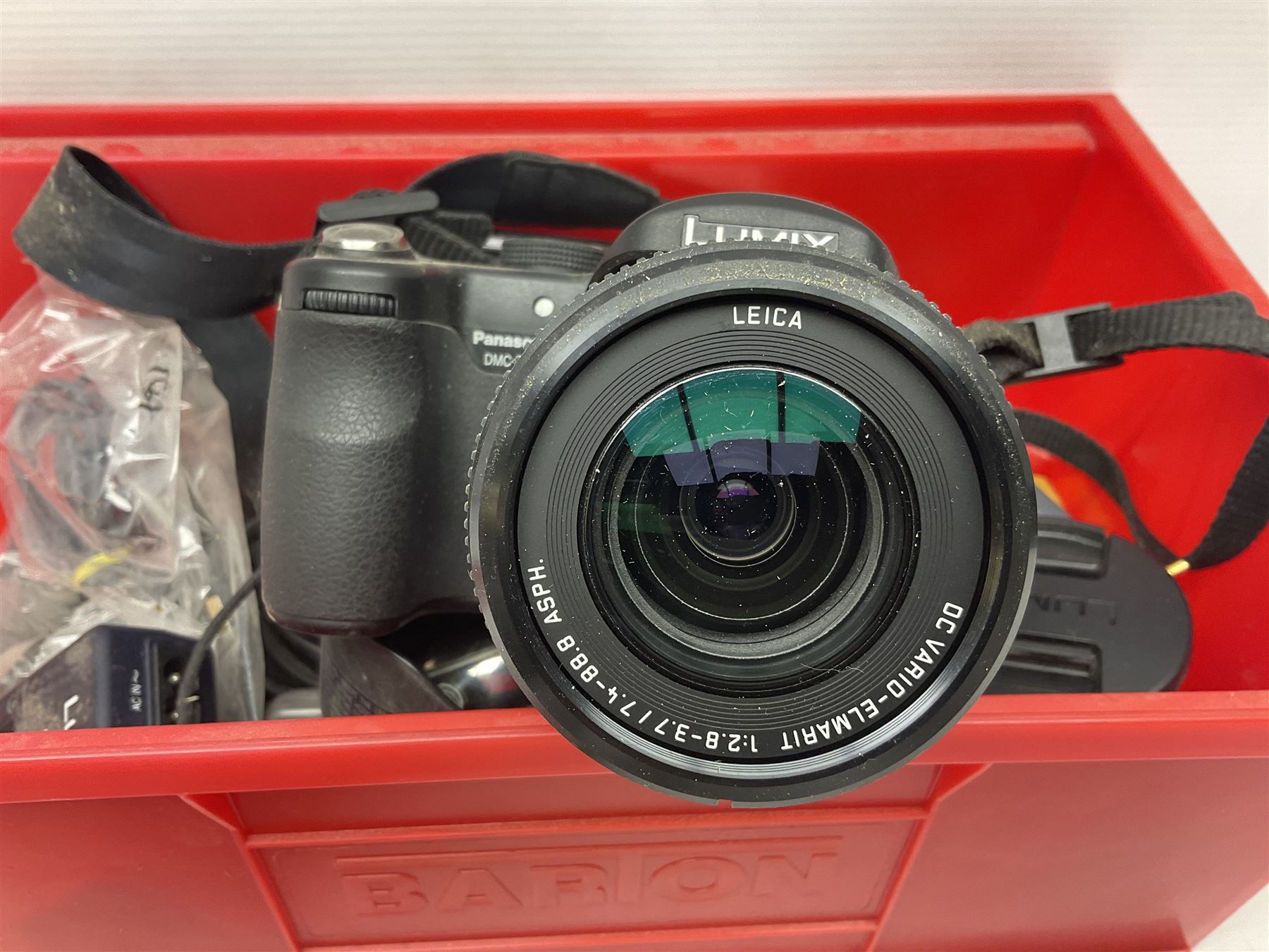 Minolta Dynax 5xi camera body serial no 17222646 with 'AF Zoom Xi 28-80mm 1:4(22)-56' lens serial no 17220881, Minolta SRT101 camera body serial 1944687, Lumix camera body serial no K6SC10168 etc 