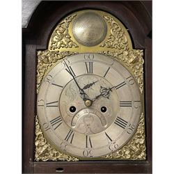 Thomas Hutchinson of Leeds - 18th century 8-day oak longcase clock with as broken arched  pediment and moulded cornice, with a conforming hood door flanked by plain turned pilasters with gesso capitals,  long trunk door with a wavy top on a square plinth with a raised panel, brass dial with cast spandrels,  engraved silvered dial centre and chapter ring with Roman numerals, five minute Arabic's and minute track, with pierced steel hands, seconds pointer,  arched calendar aperture and silvered boss engraved with the makers name to the break arch, dial pinned to a rack striking two train movement with a recoil anchor escapement. With weights and pendulum. Thomas Hutchinson is recorded as working in Leeds from 1760-90.