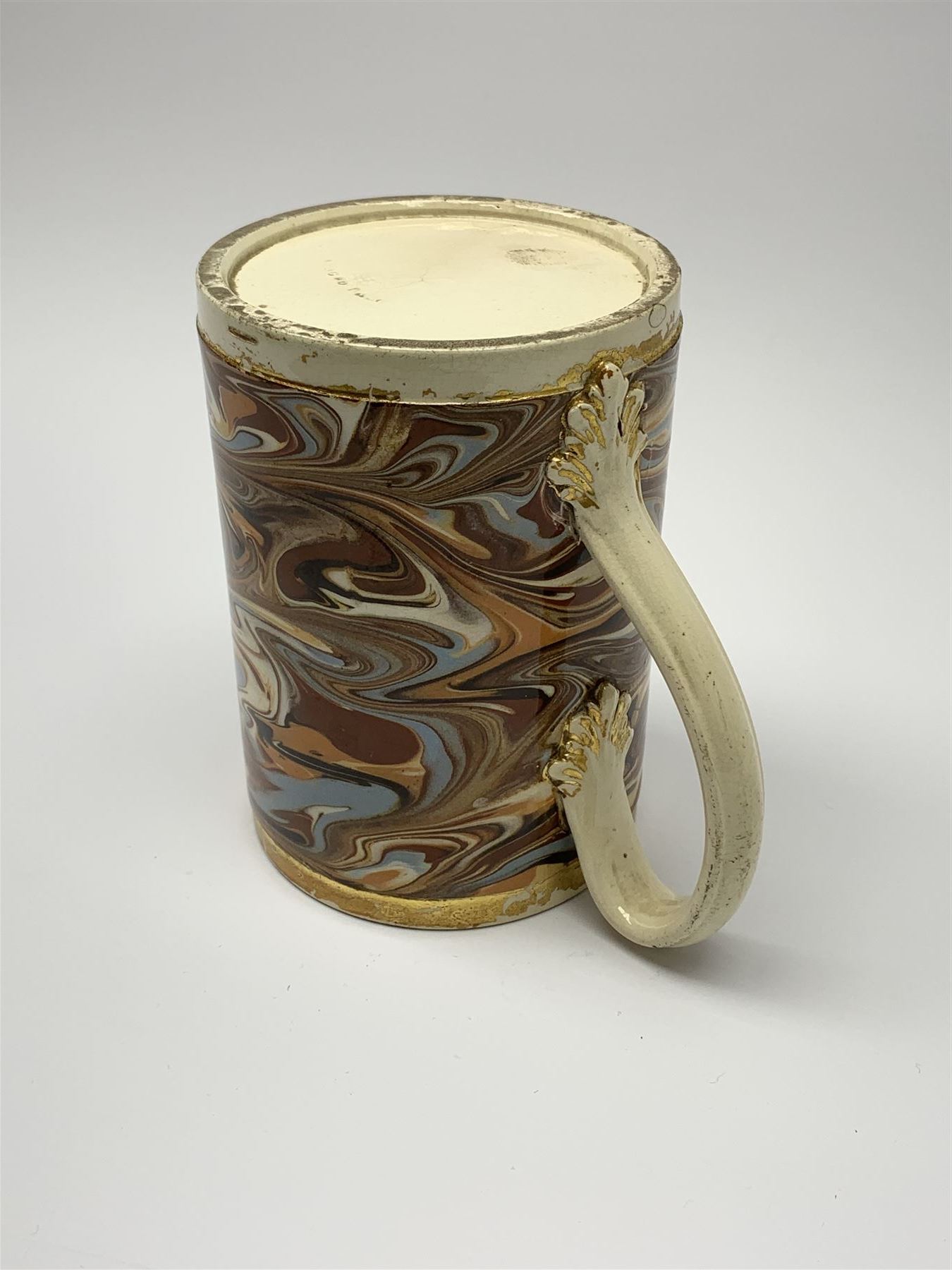 Late 18th century earthenware mug, possibly Ralph Wedgwood, Burslem or Ferrybridge, with surface marbled decoration and later gilt detail to rims and handle, impressed beneath Wedgwood & Co, H12cm