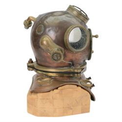 19th century Franz Clouth three bolt copper and brass diving helmet, inscribed 'Franz Clouth Kncinische Gummiwaarenfabrik m b H COLN NIPPES', matching numbers T A 7 on top and corselet rims, with handmade wooden stand, together with a reference book 'Diving Helmets' by Anthony Pardoe, which features the helmet on pages 146 and 147, helmet W42cm, H40cm, H50cm
