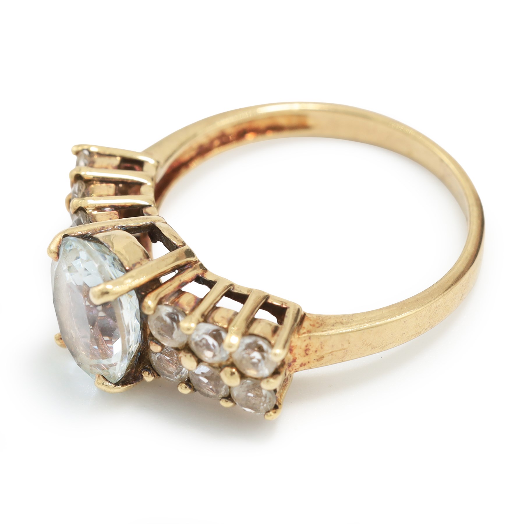 9ct gold aquamarine and blue topaz ring, single oval cut aquamarine, with two rows of round cut topaz's set either side, hallmarked