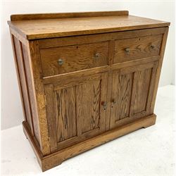 Medium oak sideboard, raised shaped back above two drawers and two cupboards, plinth base