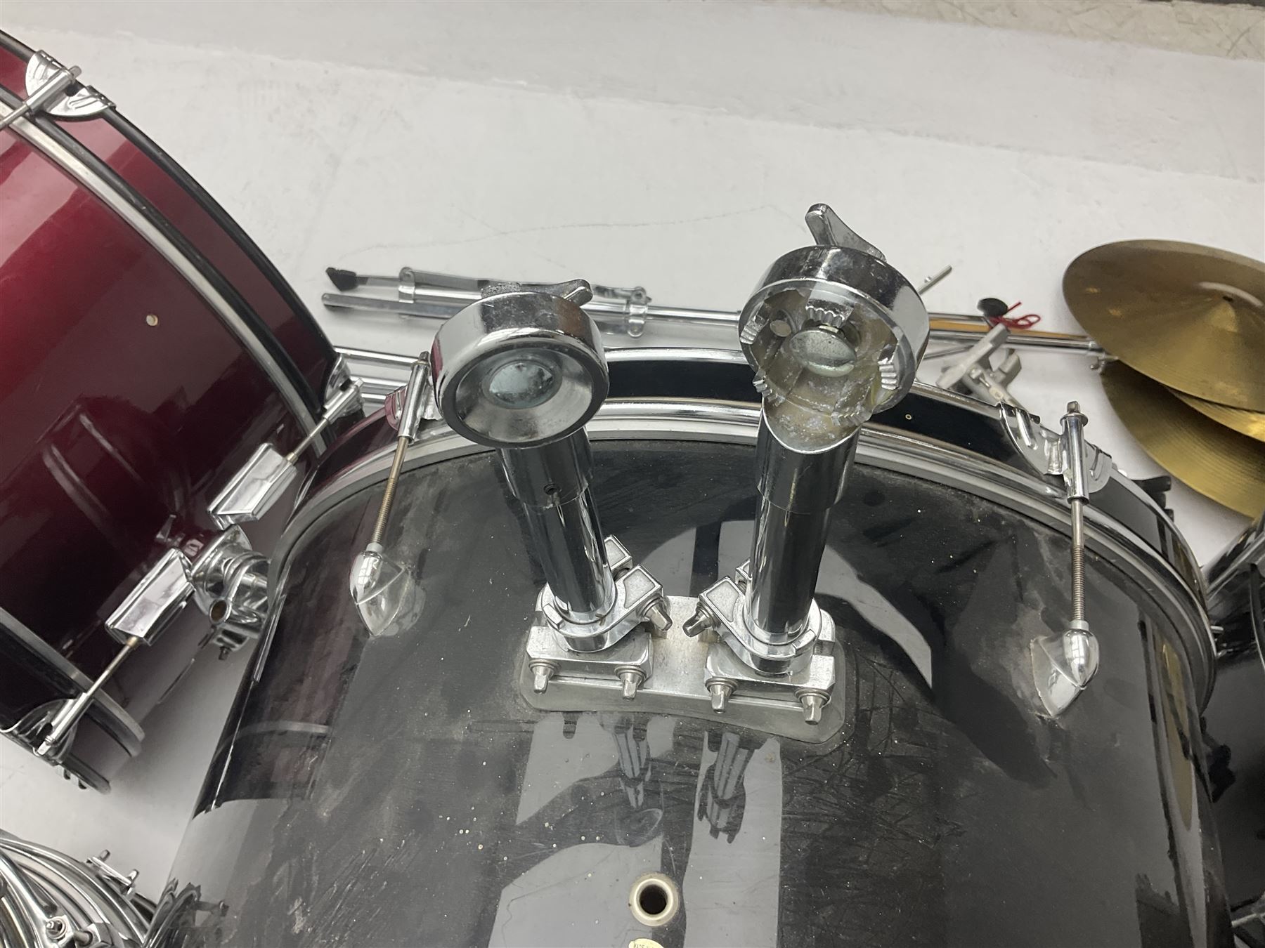 Rockburn eight-piece black drum kit with bass drum, floor tom and five other toms and snare drum; together with two other snare drums; Haosen bass drum; four cymbals; various stands, foot pedals, stool, tri-angle, drum sticks etc