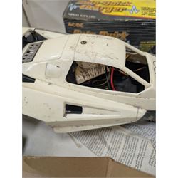 Tamiya 'The Grasshopper' 1:10 scale remote control car, boxed, together with an Acombs Techniplus-a controller, both boxed
