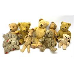 Collection of nine various English and Continental teddy bears 1930s-50s including an Irish seated bear with wind-up musical movement and plastic dog type nose  with red felt mouth H12