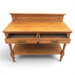 Edwardian oak serving table, raised panelled back over moulded rectangular top, fitted with two frieze drawers with brass drop handles, fluted front uprights, on turned supports united by potboard undertier