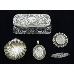 Victorian silver locket and circular brooch and an Edwardian silver brooch, Edwardian silver lidded galss dressing table box and a shell dish, all hallmarked