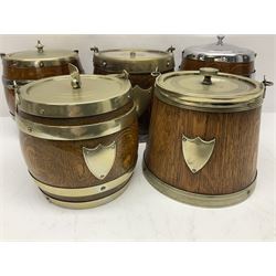 Five early 20th century biscuit barrels with silver-plated mounts