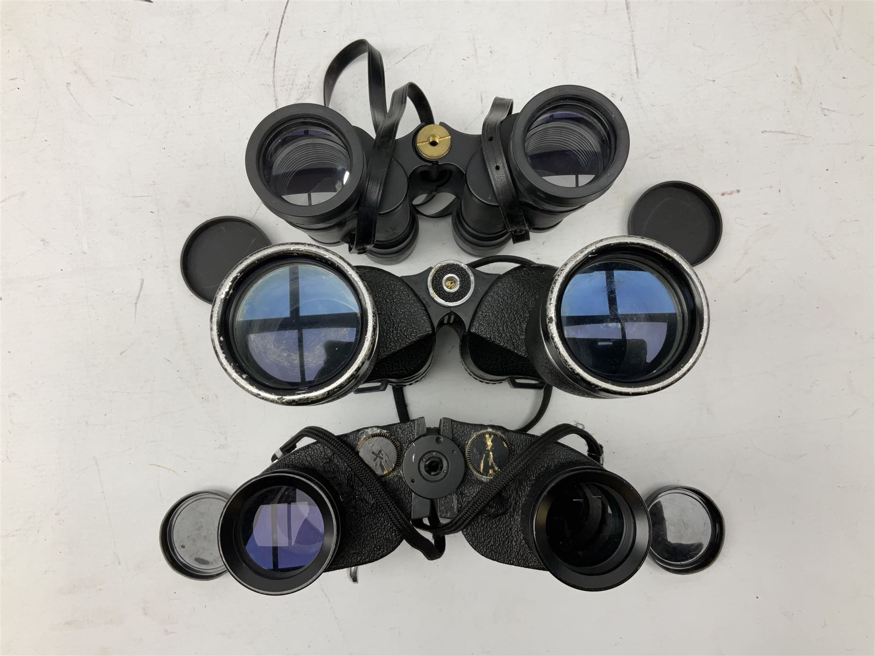 Eleven cased pairs of binoculars, to include Omiya 8x30, Tasco, Esde-Optik 8x40 Weitwinkel, Chinon 10x50 Field. Aico Rapide 8x30, Astralite zoom 6x- 14x32, etc