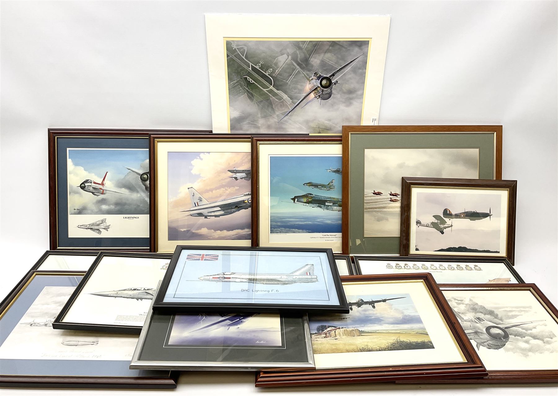 Thirteen framed and one unframed prints of military aircraft; and framed cross-stitch picture of a BAL Lightning F.6 (15)