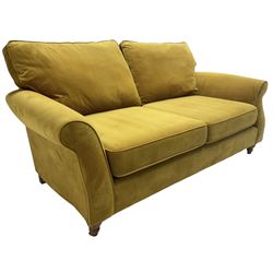 Next Furniture - traditional shaped three-seat sofa, upholstered in mustard velvet, rolled arms with pipping, on turned front feet