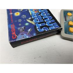 Collection of retro handheld games, including Nintendo Game & Watch ‘Snoopy Tennis’ (1982) and ‘Squish’ (1986) both with instruction booklets, Casio CG-600 ‘Star Invader’ with box, 3 in 1 LCD cartridge game including ‘Soccer’, ‘Invader’ and ‘Bomb Finder’ games, and two Grandstand ‘Pinball Wizard’ (1988) games, both with original boxes