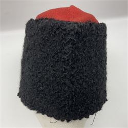 WW2 German small size Balkan style hat with 'SS' metal badges; red cloth top and flash to front with black persianelle type sides; lined in brown card with leather sweatband