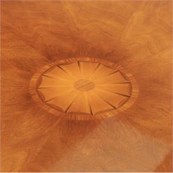 Bevan Funnell Reprodux - Regency design mahogany extending dining table, circular radial veneered top with central fan inlaid patera, on turned pedestal with four reeded downswept supports terminating in brass caps and castors, with six addtional leaves in a fitted storage case