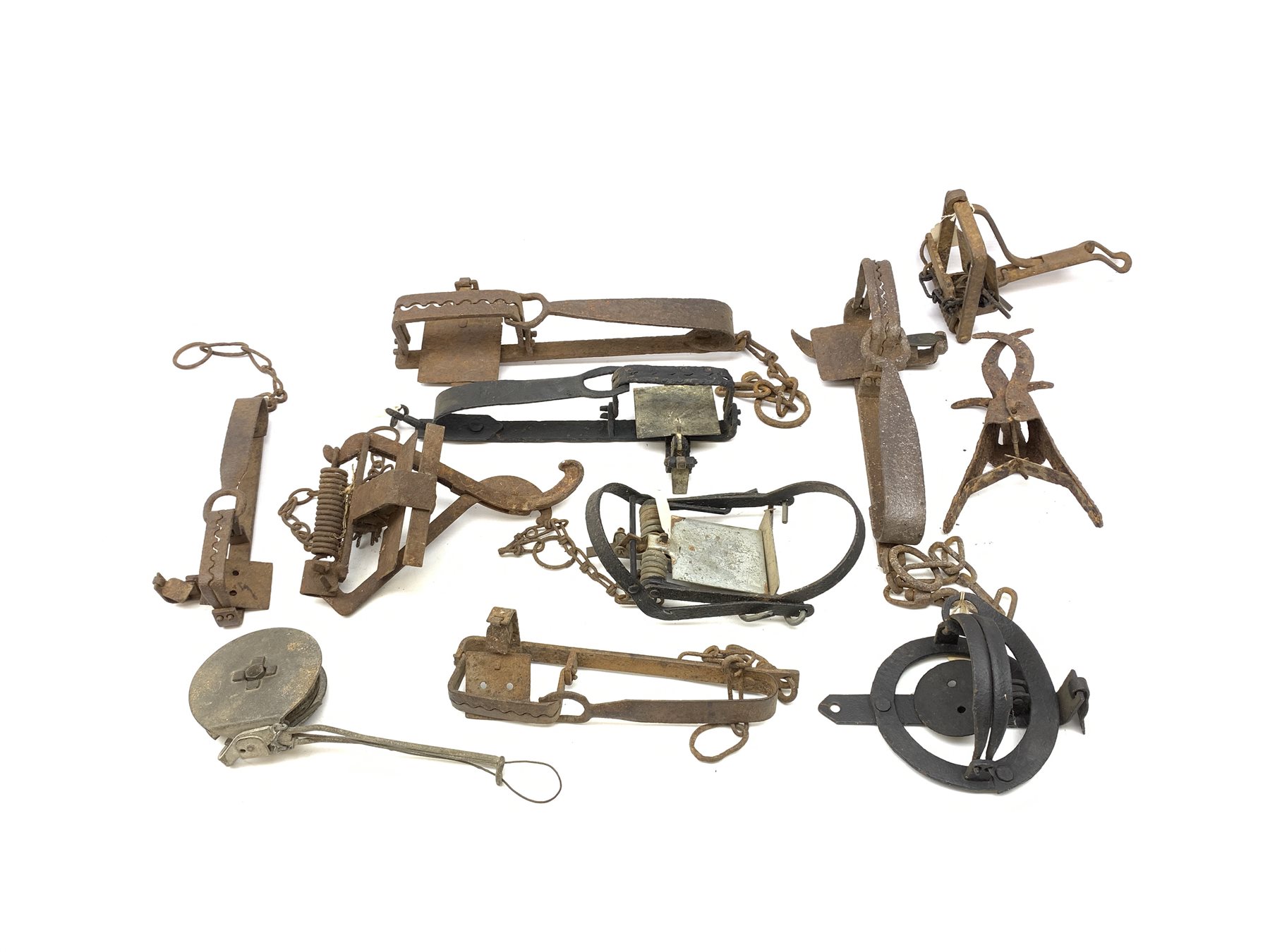 Eleven gin and animal traps including Fenn Mark 1 rabbit trap, 'The Imbra Trap', hawk trap with flat jaws, mole traps etc. Auctioneer's Note: These traps are sold as artefacts for ornamental purposes only as the use of some of them is illegal.