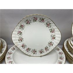 Minton Spring Bouquet pattern dinner and tea service, comprising dinner plates, twin handled tureens with covers, meat platter, teapot, milk jug, sugar bowl with cover, tea cups and saucers, bowls, cake plate, side plates, dessert plates, etc all with printed mark beneath (82)