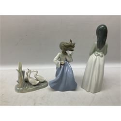 Collection of Nao figures, to include large figure of a walking lady carring a small dog and hat, H33cm, with box, together with seated young girl with dog, ballerina, clown, etc, all with printed marks beneath (9)