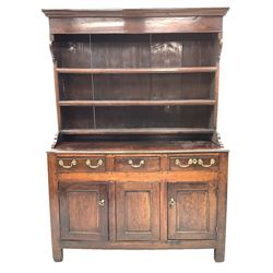 18th century oak dresser, projecting cornice over frieze and three moulded shelves, the base fitted with three short drawers above three panelled cupboard doors, raised on stile supports 