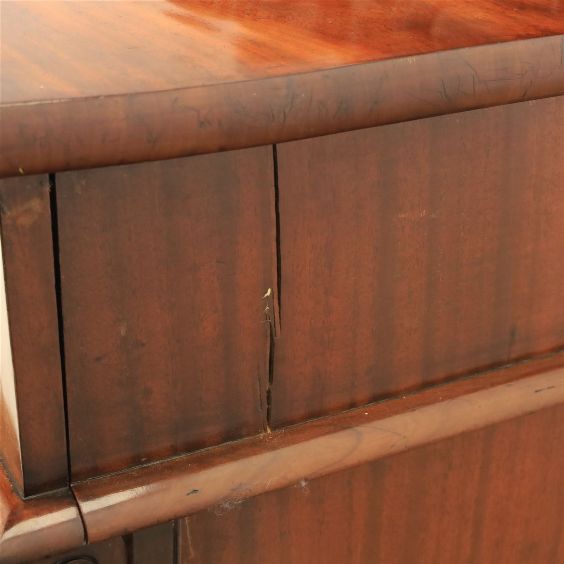 Mid Victorian mahogany pedestal sideboard, the rectangular top with raised back centred by a carved shell within scrolling acanthus and foliate cresting, over a central shaped frieze drawer flanked by two short drawers, above a kneehole recess, flanked by panelled cupboard doors with carved corbel supports, enclosing shelved interiors