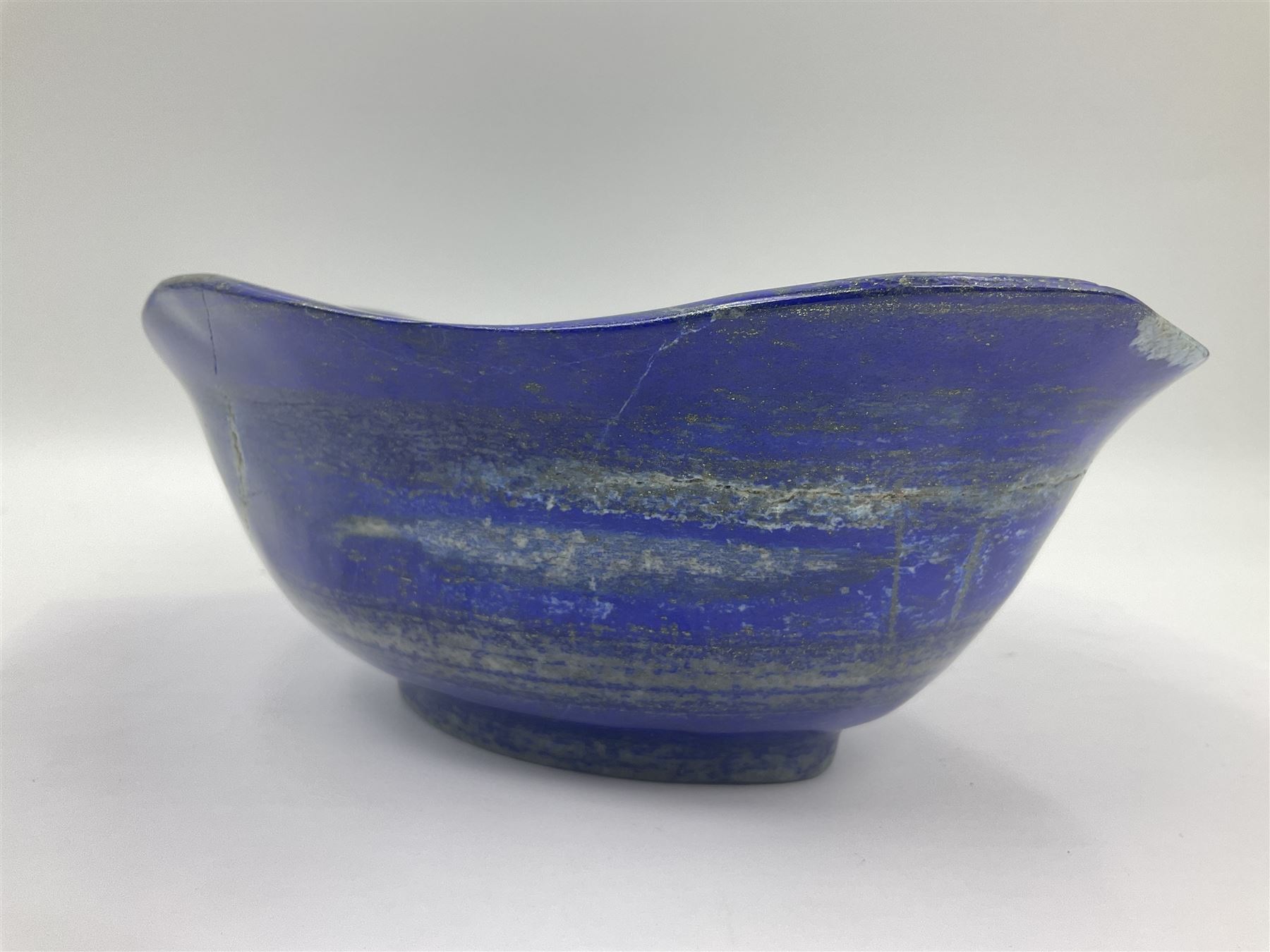 Carved bowl, flat-bottomed bowl carved from a single piece of Lapis lazuli with flared rim, H8cm, L21cm